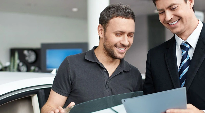 Happy customer buying a vehicle